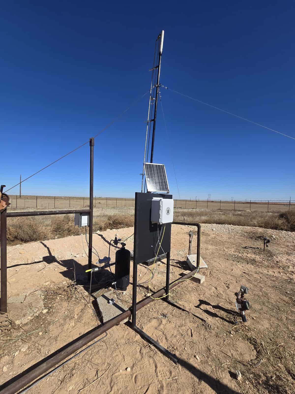 ROS solar-powered Wi-Fi BMS controller installed on a Permian pad